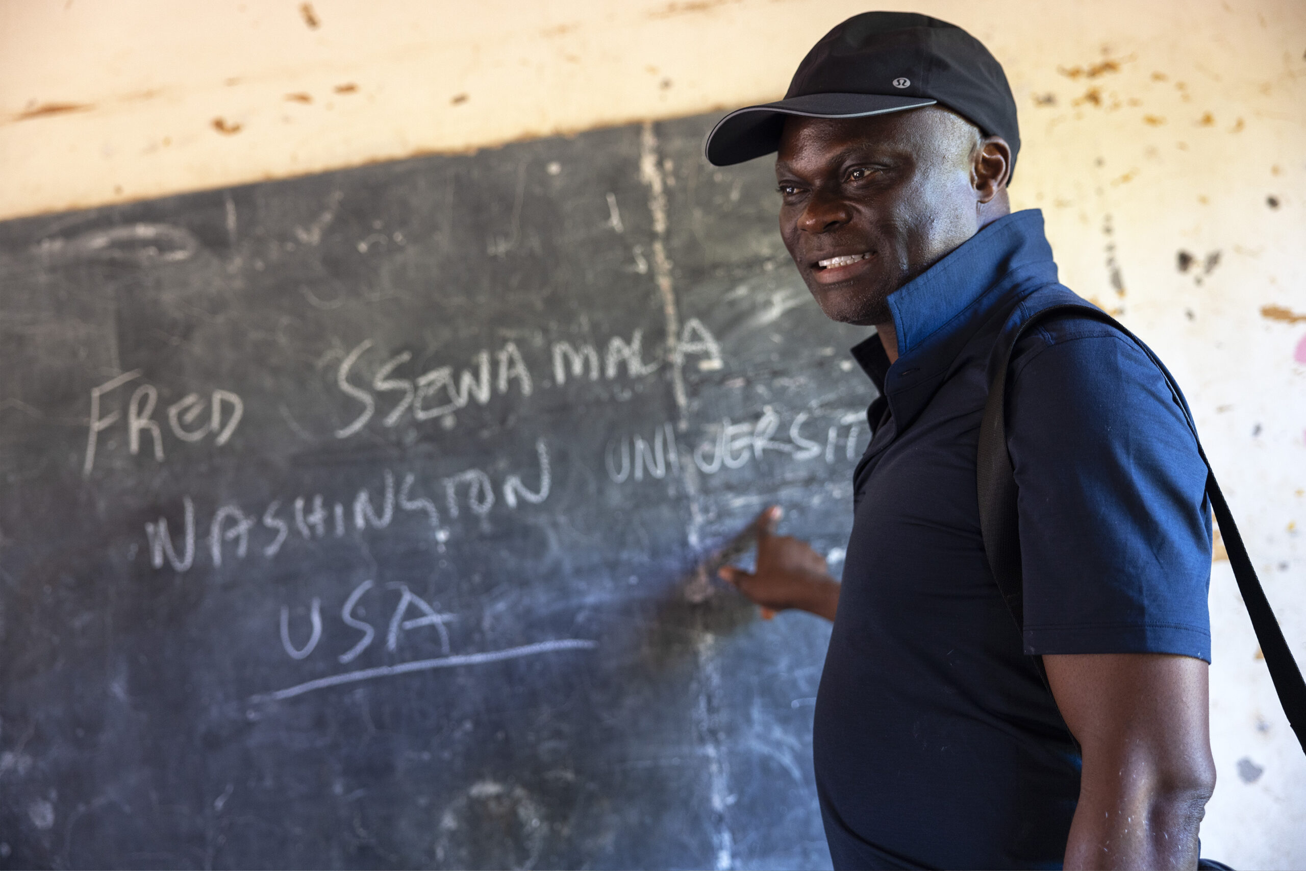 Dr. Fred M. Ssewamala interacting with primary school children