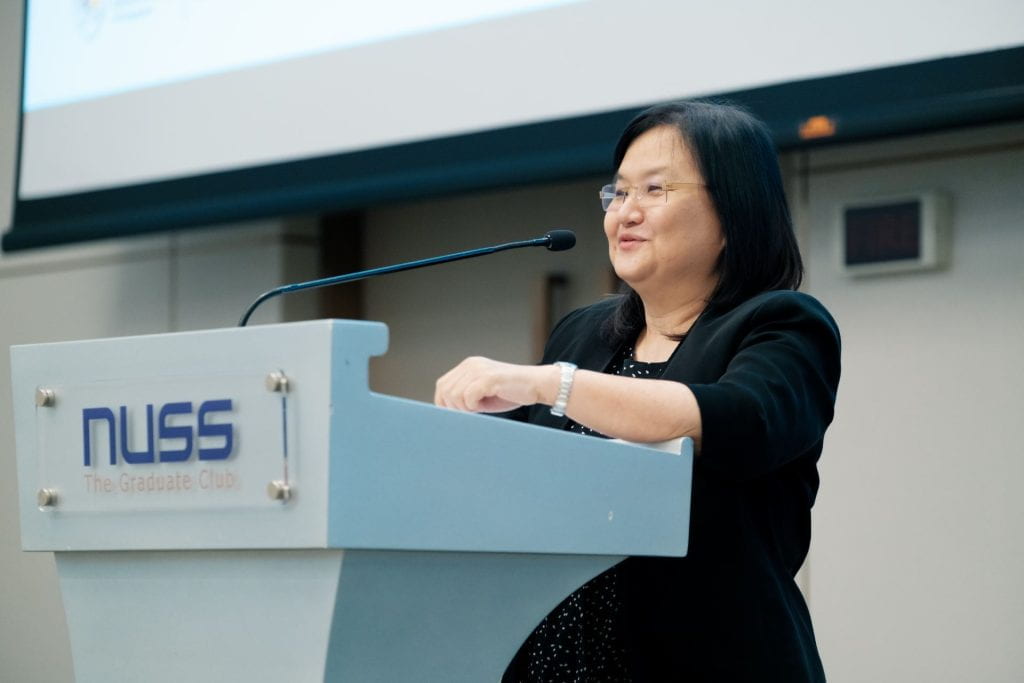 Corinne Ghoh speaking at a podium