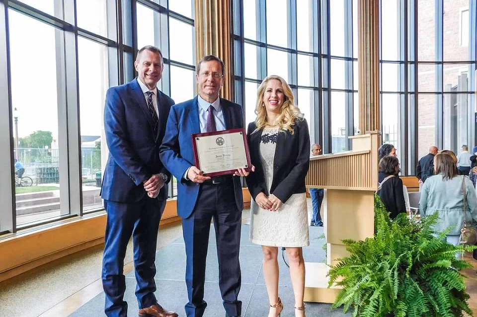 Kurt Dirks and Michal Grinstein-Weiss present then President-elect Isaac Herzog with a plaque