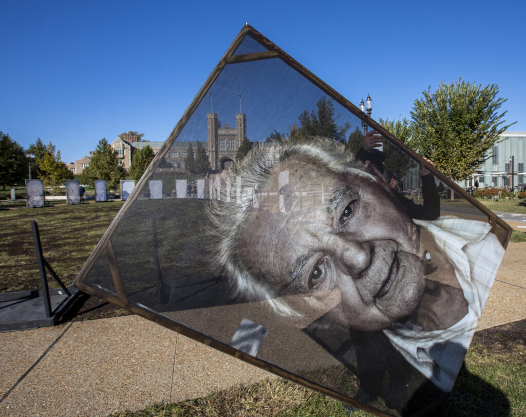 Large portrait is carried during the installation process