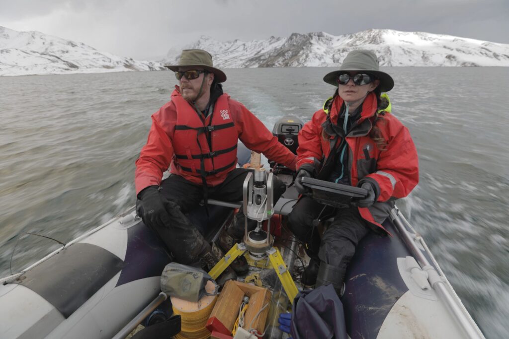 Preston Sowell and Bronwen Konecky ride in a boat